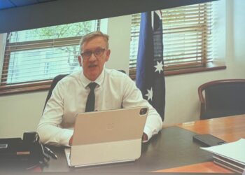 Hill unapologetic about visa processing slowdown